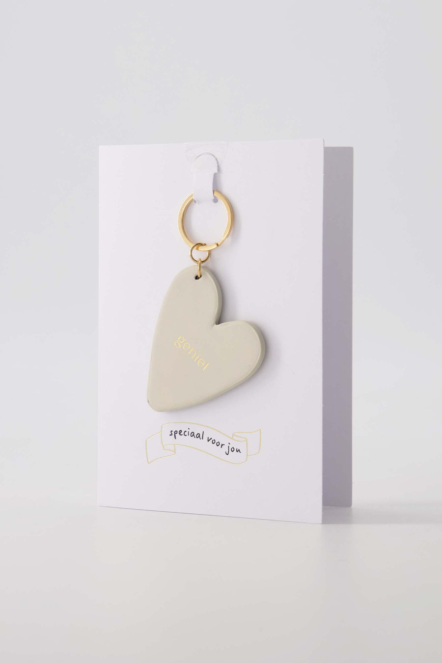 wenskaart sleutelhanger geniet zand | zand